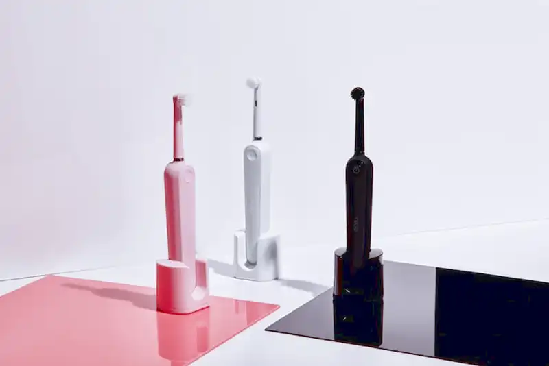 Electric toothbrush with oral irrigator