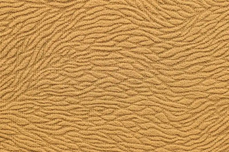 Nahaufnahme des wärmenden Materials einer langen Unterhose, mit feiner Textur und Nähten.